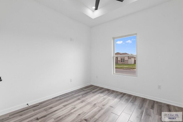 9718 Alexis Ave, Harlingen, TX 78550 - spare room featuring baseboards, ceiling fan, and light wood-style floors