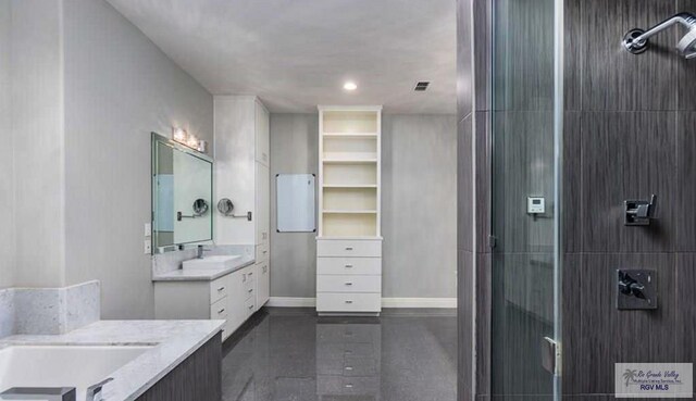 5443 Autumn Mist Ln, Brownsville, TX 78526 - full bathroom with two vanities, a stall shower, baseboards, and recessed lighting