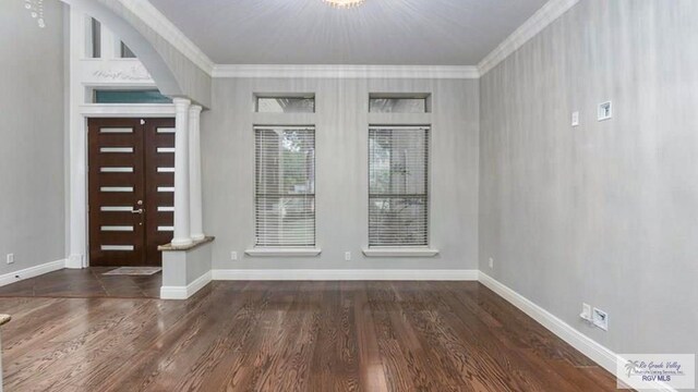 5443 Autumn Mist Ln, Brownsville, TX 78526 - entryway featuring ornamental molding, decorative columns, wood finished floors, and baseboards