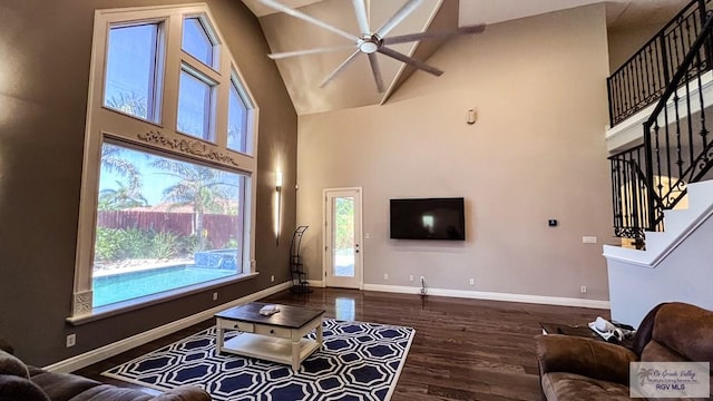 5443 Autumn Mist Ln, Brownsville, TX 78526 - living area with high vaulted ceiling, stairs, a ceiling fan, wood finished floors, and baseboards