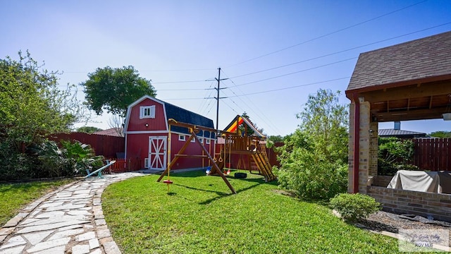 5443 Autumn Mist Ln, Brownsville, TX 78526 - view of yard featuring a barn, a playground, and an outbuilding
