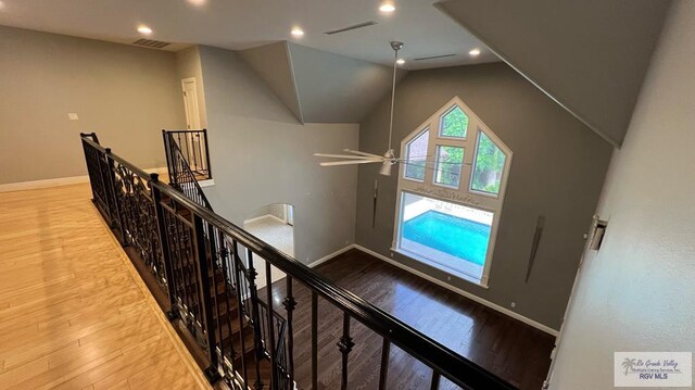 5443 Autumn Mist Ln, Brownsville, TX 78526 - stairs featuring baseboards, wood finished floors, lofted ceiling, and recessed lighting