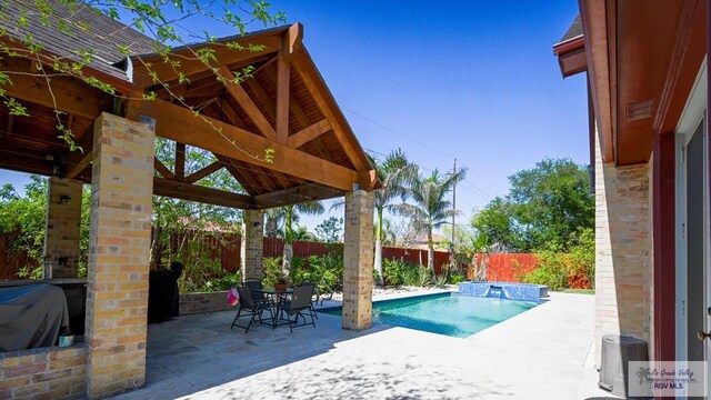 5443 Autumn Mist Ln, Brownsville, TX 78526 - view of swimming pool with a fenced backyard, a gazebo, and a patio area