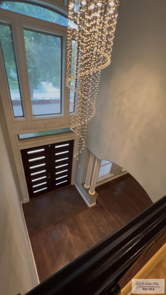 5443 Autumn Mist Ln, Brownsville, TX 78526 - foyer with a chandelier and dark wood-type flooring