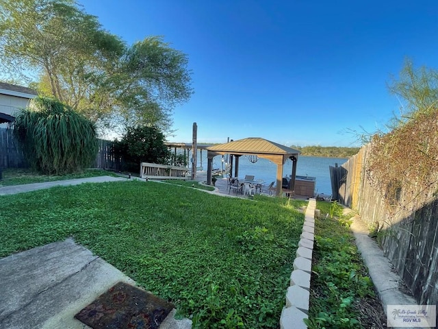 view of yard with a gazebo and a water view