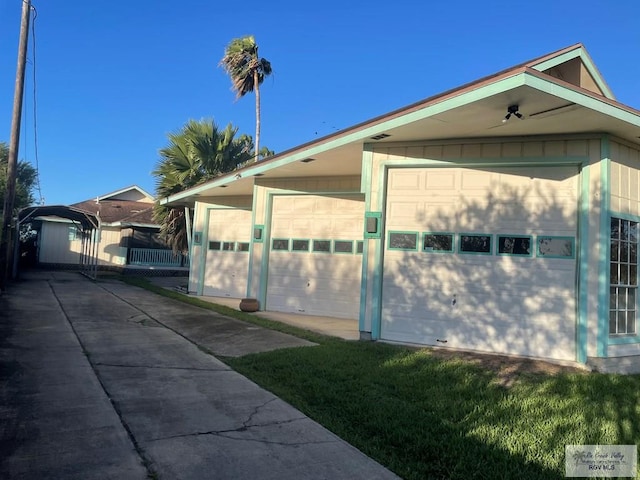 view of side of home with a garage and an outdoor structure