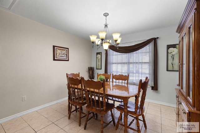 tiled dining space featuring a notable chandelier