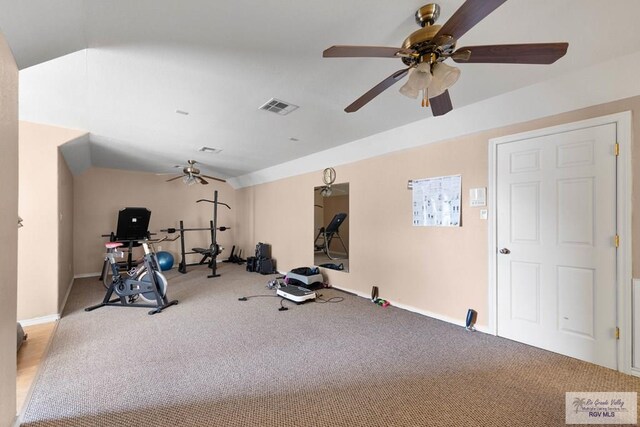 workout room with carpet, vaulted ceiling, and ceiling fan