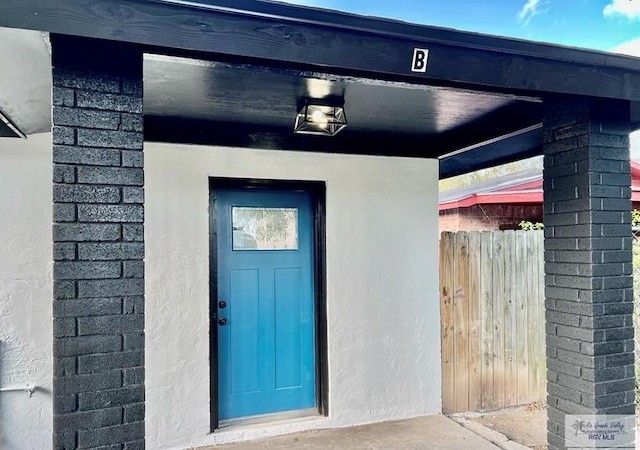 property entrance with fence