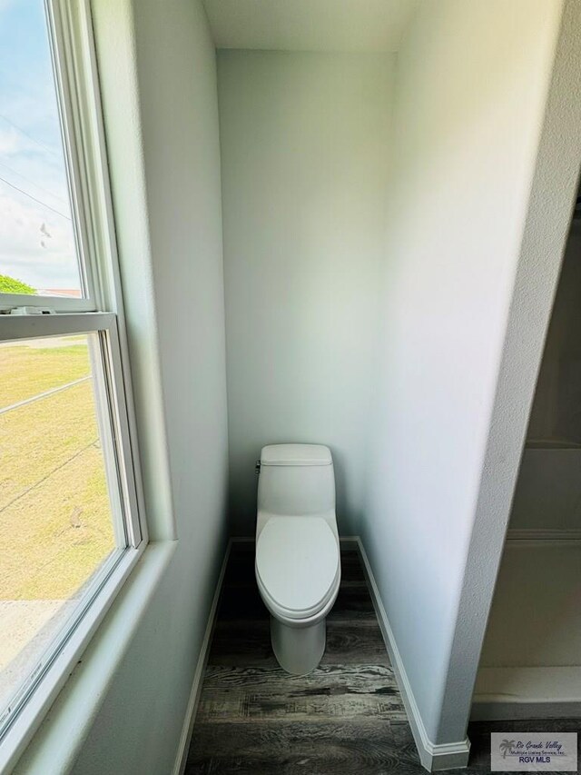 bathroom featuring toilet and hardwood / wood-style flooring