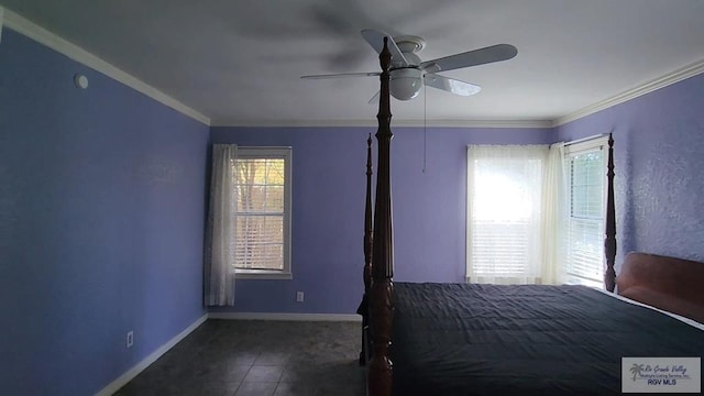 unfurnished bedroom with dark tile patterned floors, ornamental molding, and ceiling fan