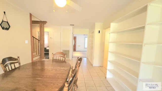 tiled dining room featuring ceiling fan