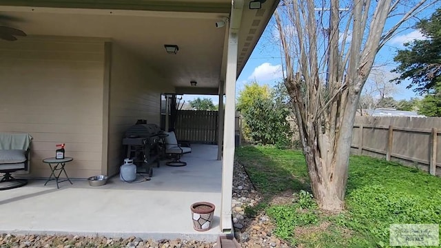 view of patio with a grill