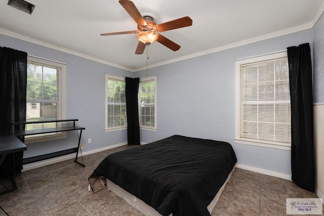 bedroom with ceiling fan and crown molding