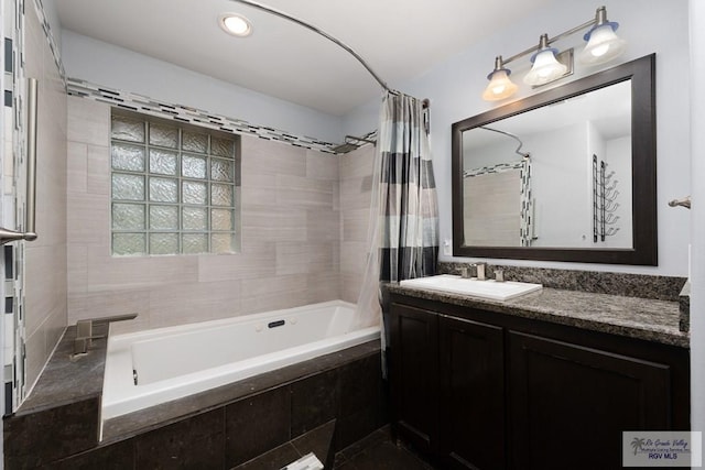 bathroom featuring vanity and shower / bath combination with curtain