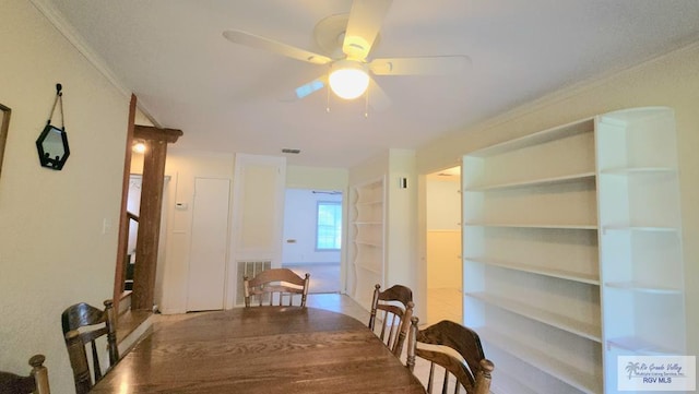 dining space with ornamental molding and ceiling fan