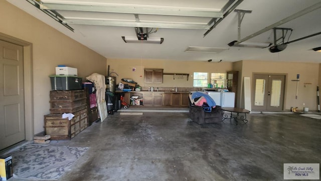 garage featuring washing machine and clothes dryer