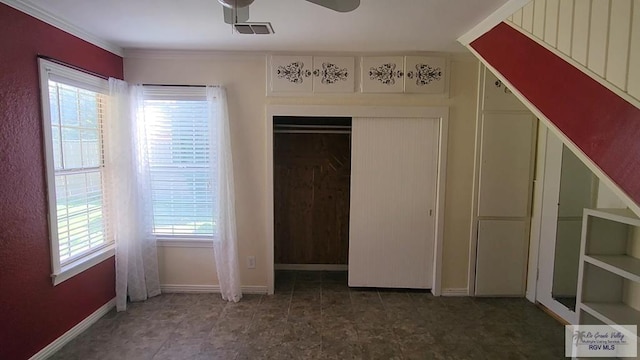 unfurnished bedroom with ceiling fan