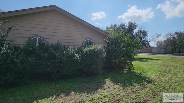 view of home's exterior featuring a yard