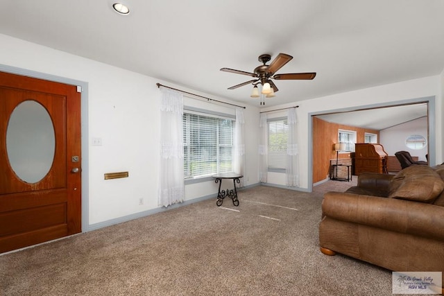 interior space with light colored carpet and ceiling fan