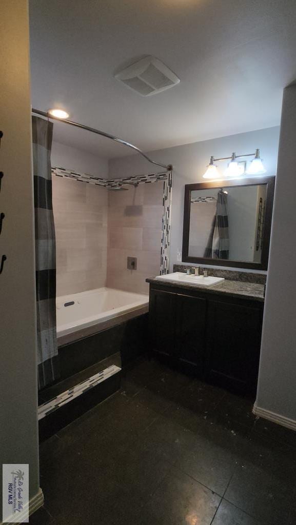 bathroom with tile patterned floors, vanity, and shower / tub combo