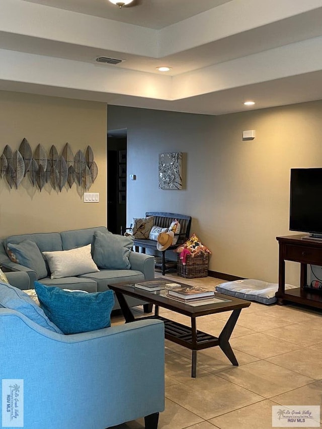living room featuring light tile patterned floors, recessed lighting, and visible vents