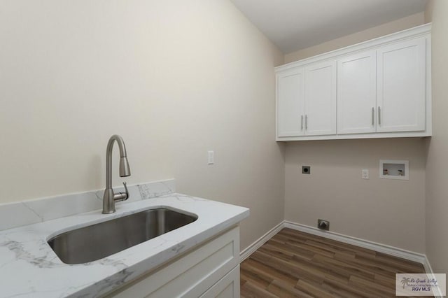 laundry area with sink, dark wood-type flooring, electric dryer hookup, hookup for a washing machine, and cabinets