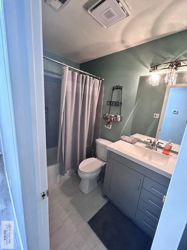 full bathroom featuring vanity, toilet, and shower / tub combo