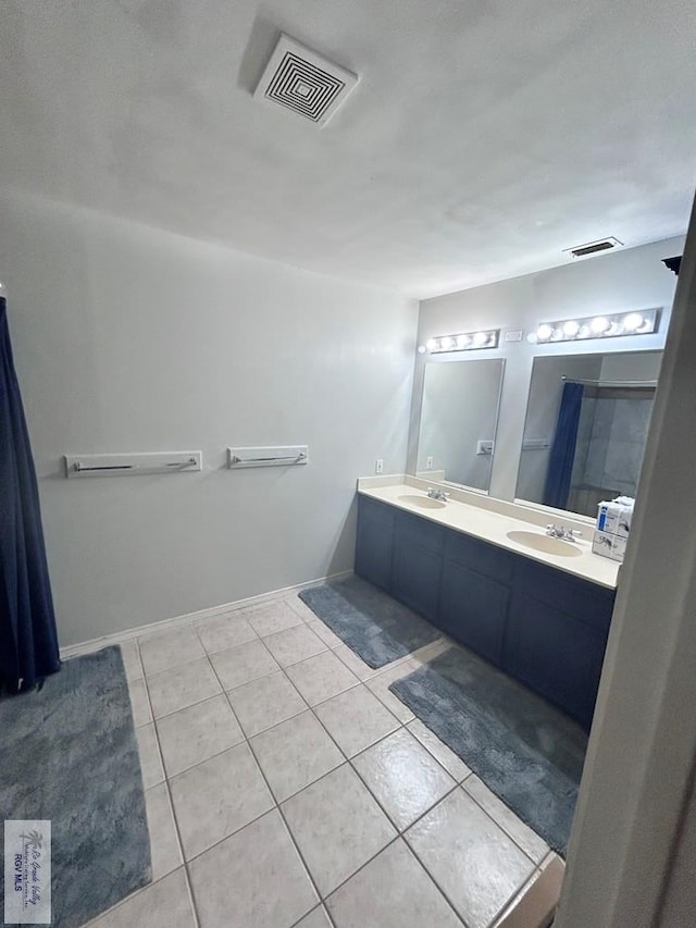 bathroom featuring tile patterned floors and vanity