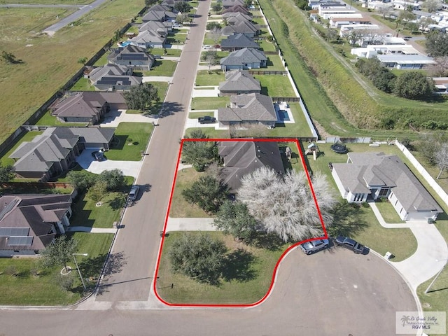 birds eye view of property with a residential view