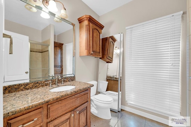 full bathroom with toilet, tile patterned flooring, vanity, and a shower with door