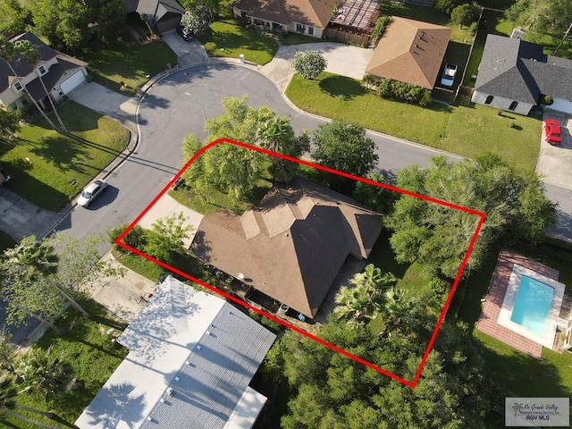 birds eye view of property with a residential view