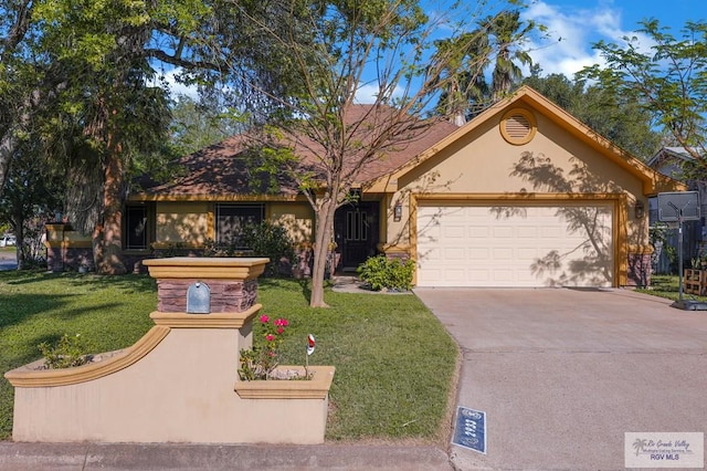 ranch-style house with an attached garage, a front yard, stucco siding, and driveway