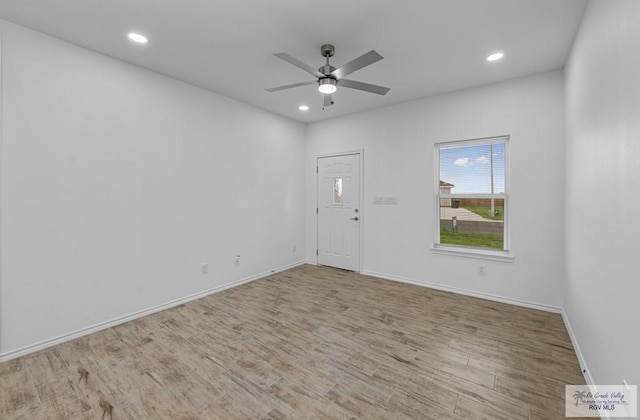 unfurnished room featuring ceiling fan and light hardwood / wood-style floors