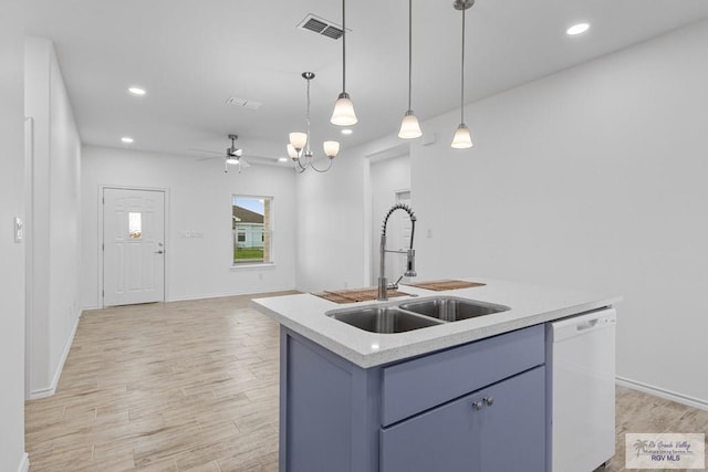 kitchen featuring dishwasher, a center island with sink, light hardwood / wood-style flooring, and sink