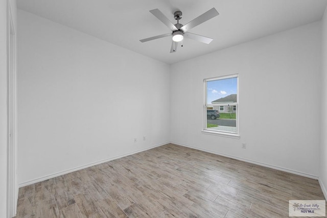 spare room featuring ceiling fan and light wood-type flooring