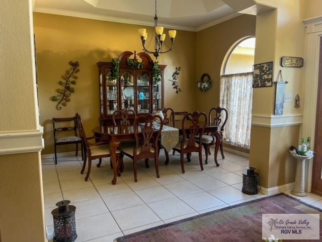 5303 Rustic Manor Dr, Brownsville, TX 78526 - dining area featuring an inviting chandelier, ornamental molding, baseboards, and light tile patterned floors