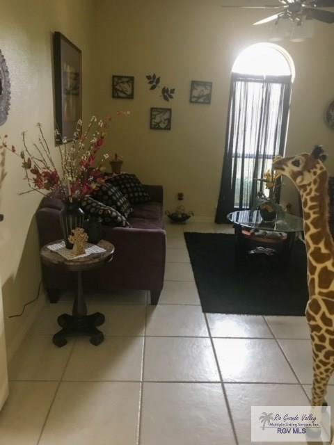 5303 Rustic Manor Dr, Brownsville, TX 78526 - living room featuring ceiling fan and light tile patterned floors