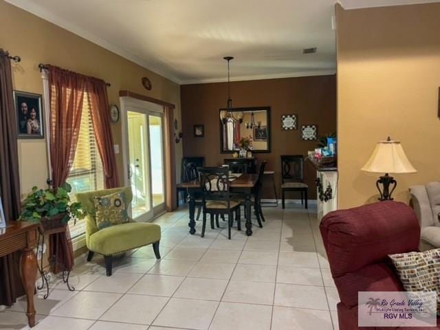 5303 Rustic Manor Dr, Brownsville, TX 78526 - dining area featuring visible vents, ornamental molding, and light tile patterned floors