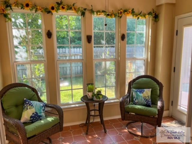 5303 Rustic Manor Dr, Brownsville, TX 78526 - sunroom with baseboards and french doors