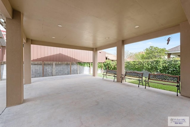 view of patio featuring fence