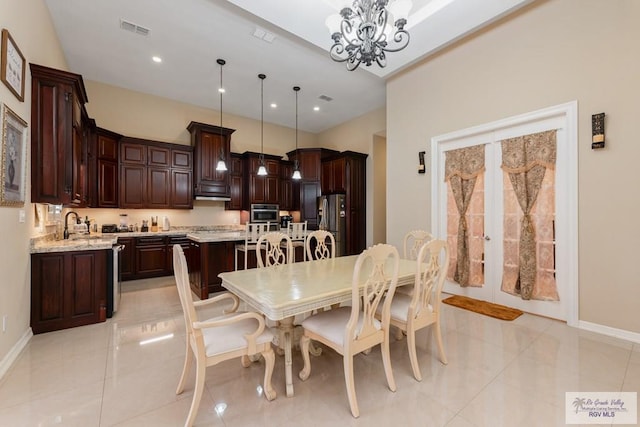 dining area featuring baseboards, visible vents, recessed lighting, and an inviting chandelier