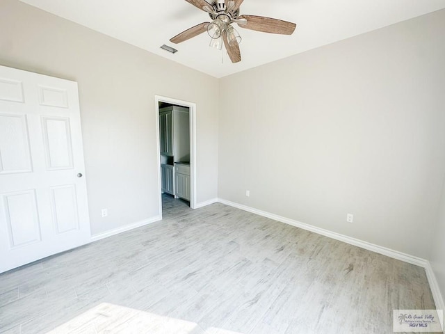 unfurnished bedroom featuring ceiling fan and light hardwood / wood-style flooring