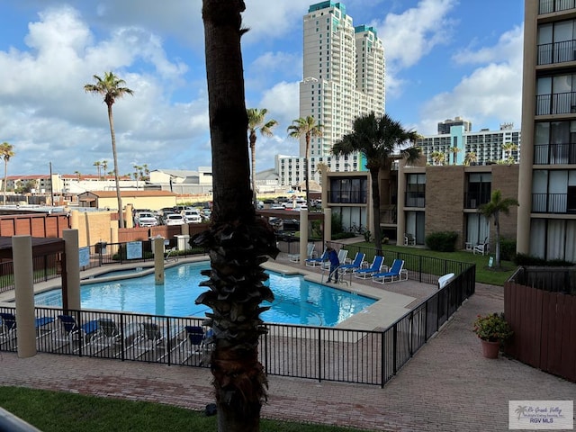 view of swimming pool featuring a patio area