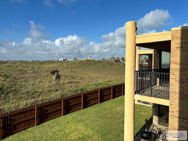 view of yard featuring a balcony