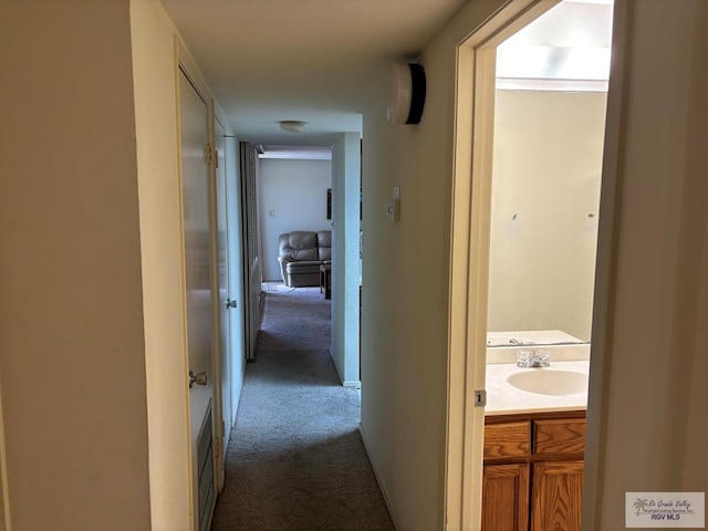 hall with carpet flooring and sink