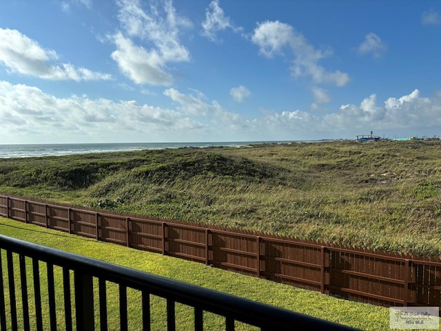 view of yard featuring a water view and a balcony