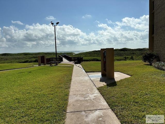 view of property's community featuring a yard