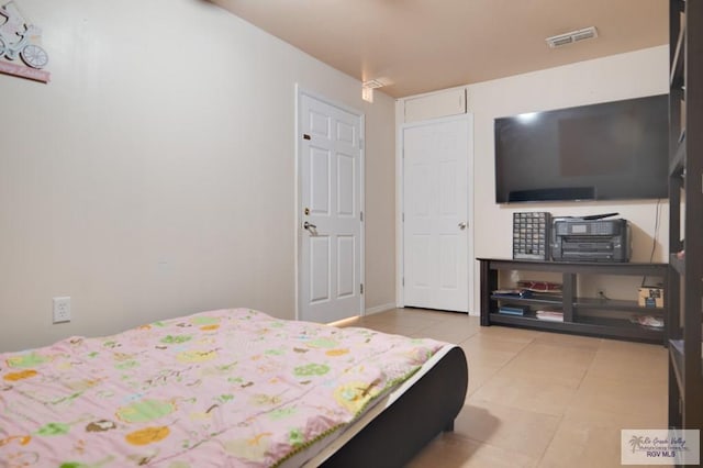 bedroom with light tile patterned flooring