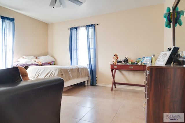 bedroom featuring ceiling fan and light tile patterned floors